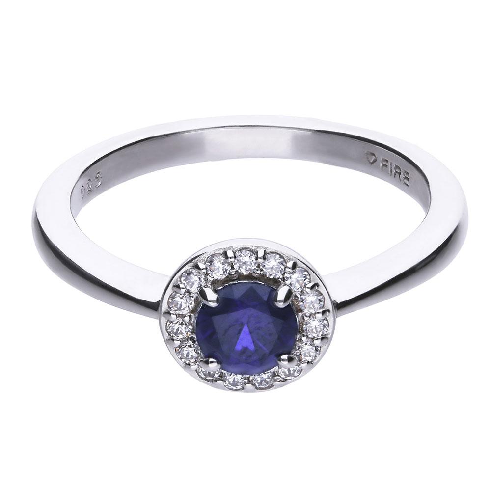 anello donna con pavè di pietre bianche zirconi e pietra centrale zircone blu. anello in stile classico in argento 925 con copertura platino e rodiatura.